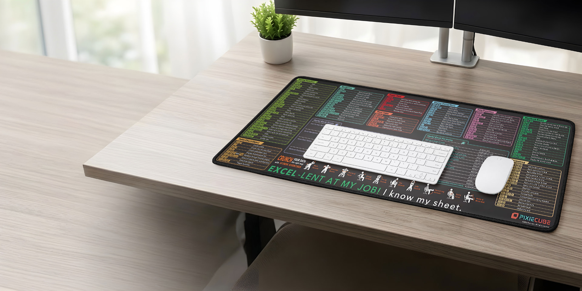 Pixiecube Excel cheat sheet desk mat with keyboard and mouse on a bright wooden desk